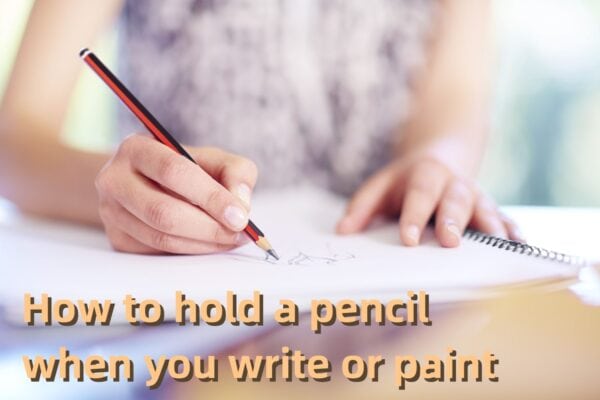 How to hold a pencil when you write or paint